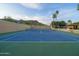 Outdoor tennis court with mountain views, palm trees, and well-maintained surface and surroundings at 7816 N 47Th St, Paradise Valley, AZ 85253
