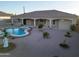 Private backyard with a refreshing pool, desert landscaping, and covered patio, creating a serene outdoor oasis at 7969 S 172Nd St, Queen Creek, AZ 85142