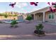 Backyard with swimming pool, desert landscaping, and covered patio at 7969 S 172Nd St, Queen Creek, AZ 85142