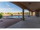 Stunning backyard showcasing a pool and spa, desert landscaping, and a covered patio ideal for outdoor living at 7969 S 172Nd St, Queen Creek, AZ 85142