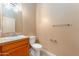Bathroom features a tile countertop, neutral paint, toilet, and towel bars at 7969 S 172Nd St, Queen Creek, AZ 85142