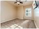 Bright bedroom featuring neutral carpeting, ceiling fan, and shuttered window at 7969 S 172Nd St, Queen Creek, AZ 85142