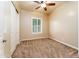 Bedroom featuring neutral paint, carpet, a ceiling fan, and a shuttered window at 7969 S 172Nd St, Queen Creek, AZ 85142