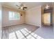 A spacious bedroom features neutral walls, carpet and tile flooring, and a ceiling fan at 7969 S 172Nd St, Queen Creek, AZ 85142