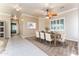 Formal dining room with large windows, a ceiling fan, and tile flooring at 7969 S 172Nd St, Queen Creek, AZ 85142