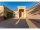 Stunning home featuring a grand entrance with elegant double doors and lush, green landscaping at 7969 S 172Nd St, Queen Creek, AZ 85142