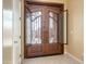 Elegant front door with decorative metalwork, offering a glimpse of the outside at 7969 S 172Nd St, Queen Creek, AZ 85142