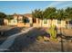 Charming single-story home with desert landscaping, mature trees, and a quaint stone entrance at 7969 S 172Nd St, Queen Creek, AZ 85142