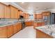 Gourmet kitchen features stainless steel appliances, granite counters, and a central island at 7969 S 172Nd St, Queen Creek, AZ 85142