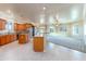An open concept kitchen boasts stainless steel appliances, granite counters and island seating at 7969 S 172Nd St, Queen Creek, AZ 85142