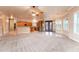 Open concept living room boasts lots of natural light, an updated kitchen, and tile floors at 7969 S 172Nd St, Queen Creek, AZ 85142