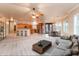 Open concept living space with fireplace, updated kitchen, modern lighting and multiple windows at 7969 S 172Nd St, Queen Creek, AZ 85142