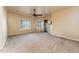 Bright main bedroom features neutral paint, carpet, a ceiling fan, and large shuttered windows at 7969 S 172Nd St, Queen Creek, AZ 85142