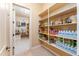 A well-stocked walk-in pantry provides generous shelving for dry goods and supplies at 7969 S 172Nd St, Queen Creek, AZ 85142