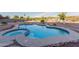 Backyard pool with hot tub surrounded by desert landscaping at 7969 S 172Nd St, Queen Creek, AZ 85142