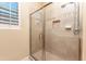Shower features neutral tile, a glass door and a built-in toiletry niche at 7969 S 172Nd St, Queen Creek, AZ 85142