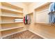 Walk-in closet featuring built in shelving and racks for optimized storage at 7969 S 172Nd St, Queen Creek, AZ 85142