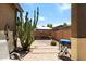 Enjoy the backyard featuring desert landscaping, brick-lined concrete and a cozy dining area at 799 W Press Rd, San Tan Valley, AZ 85140
