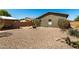 Spacious backyard with desert landscaping, rock ground cover and a cozy dining area at 799 W Press Rd, San Tan Valley, AZ 85140