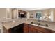 Inviting kitchen showcasing stainless steel appliances, granite counters, and dark wood cabinetry at 799 W Press Rd, San Tan Valley, AZ 85140
