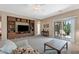 Bright and airy living room with built-in shelving, access to the backyard patio, and neutral carpet at 799 W Press Rd, San Tan Valley, AZ 85140