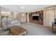 Spacious open-concept living room featuring built-in shelving and an adjoining breakfast bar at 799 W Press Rd, San Tan Valley, AZ 85140