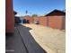 Backyard featuring gravel, brick walls, and pavers at 8609 S 16Th St, Phoenix, AZ 85042