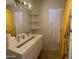 Modern bathroom featuring a sleek vanity, stylish mirror, and contemporary fixtures at 8609 S 16Th St, Phoenix, AZ 85042