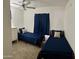 Bedroom featuring carpeted floors and two twin beds with dark blue linens at 8609 S 16Th St, Phoenix, AZ 85042