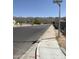 View of a quiet residential street with mountain views and desert landscaping at 8609 S 16Th St, Phoenix, AZ 85042