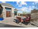 Charming backyard area with outdoor dining set, potted plants and mountain views at 9280 E Thompson Peak Pkwy # 39, Scottsdale, AZ 85255