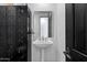 Powder room featuring black lockers and a pedestal sink with mirror at 9280 E Thompson Peak Pkwy # 39, Scottsdale, AZ 85255