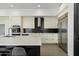 Well-lit modern kitchen with stainless steel appliances, a sleek backsplash, and a spacious layout at 9280 E Thompson Peak Pkwy # 39, Scottsdale, AZ 85255