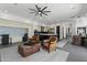 Spacious living area with comfortable seating, a sleek workspace, and seamless access to the modern kitchen at 9280 E Thompson Peak Pkwy # 39, Scottsdale, AZ 85255