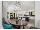 Open-concept living space with a modern kitchen, dining area, and cozy seating arrangement with a fireplace at 9280 E Thompson Peak Pkwy # 39, Scottsdale, AZ 85255