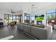 An open living room with golf course views, fireplace and modern light fixture at 9280 E Thompson Peak Pkwy # 39, Scottsdale, AZ 85255
