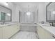 Elegant main bathroom with double vanity, soaking tub, and modern chandelier at 9280 E Thompson Peak Pkwy # 39, Scottsdale, AZ 85255