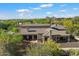 Luxury home featuring a tile roof, desert landscaping, mountain views, and a private outdoor living space at 9280 E Thompson Peak Pkwy # 39, Scottsdale, AZ 85255