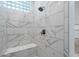 Elegant shower with marble-patterned tiling and a convenient built-in bench at 9280 E Thompson Peak Pkwy # 39, Scottsdale, AZ 85255