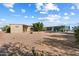 Expansive backyard with desert landscaping and outdoor storage shed at 9347 E Edgewood Ave, Mesa, AZ 85208