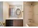 Bathroom with shower-tub combination and single sink vanity with drawers at 9347 E Edgewood Ave, Mesa, AZ 85208