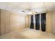 Bedroom featuring a ceiling fan, closet, carpet, and window with black curtains at 9347 E Edgewood Ave, Mesa, AZ 85208