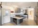 Neutral kitchen design with white backsplash, gray cabinets, and a unique peninsula at 9347 E Edgewood Ave, Mesa, AZ 85208