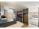 This kitchen features gray cabinets, modern appliances, and an island bar space at 9347 E Edgewood Ave, Mesa, AZ 85208
