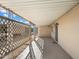 Covered patio featuring lattice privacy screen and concrete flooring at 9347 E Edgewood Ave, Mesa, AZ 85208
