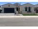 Charming single Gathering home with a private gated courtyard, an attached garage, and manicured landscaping at 1185 E Gleneagle Dr, Chandler, AZ 85249