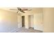 Bedroom featuring carpet, closet, and open doorway at 14748 W Willow Ln, Surprise, AZ 85374