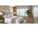 Relaxing bedroom with a comfortable bed, serene decor, and a view of the pool at 14748 W Willow Ln, Surprise, AZ 85374