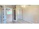 Bedroom with doorway to living room, closet, and tile floors at 14748 W Willow Ln, Surprise, AZ 85374