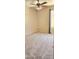 Bedroom with carpet, ceiling fan, and window at 14748 W Willow Ln, Surprise, AZ 85374